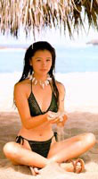 Vivian Hsu sitting on beach